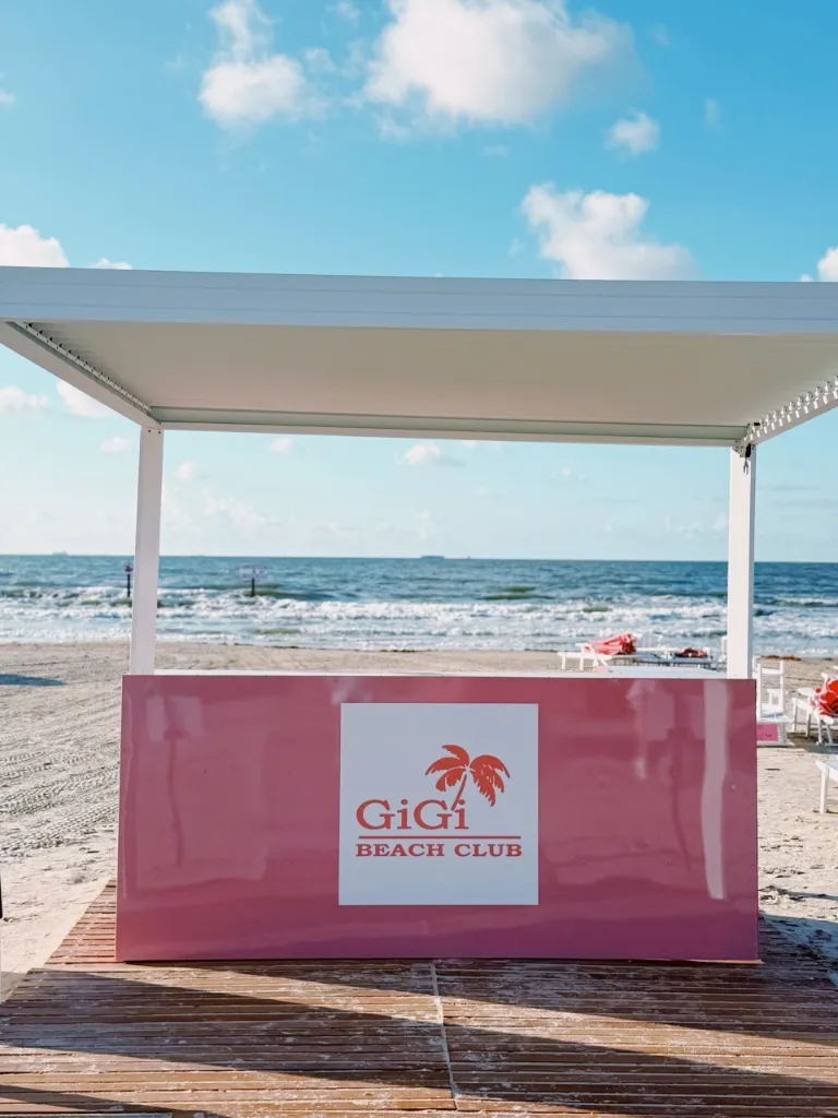 Galveston beach with pink umbrellas